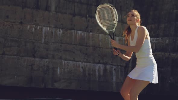 Woman playing tennis on a sunny day