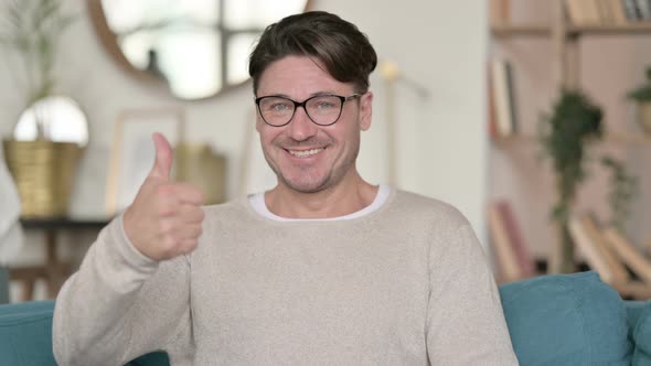 Middle Aged Man with Thumbs Up at Home 