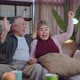 asian couple watching TV at home,old mature asian couple cheering sport games - VideoHive Item for Sale