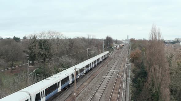 Overhead profile follow drone shot of elizabeth line TfL rail train