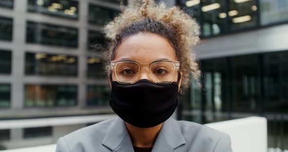 AfricanAmerican Businesswoman Looks at the Camera