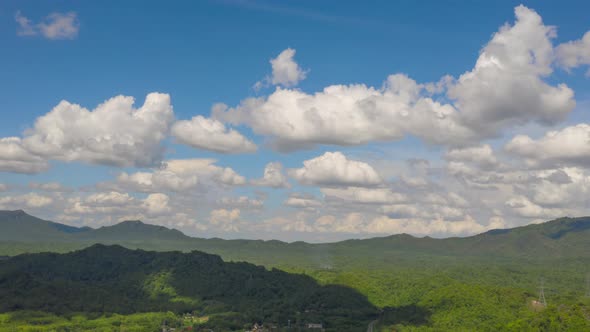 Electricity Pylon on mountains and moving clouds,