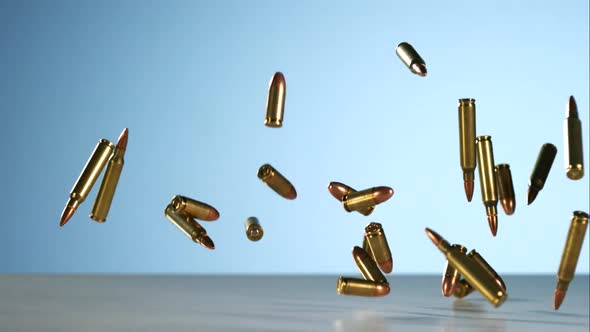 Bullets falling bouncing in ultra slow motion 