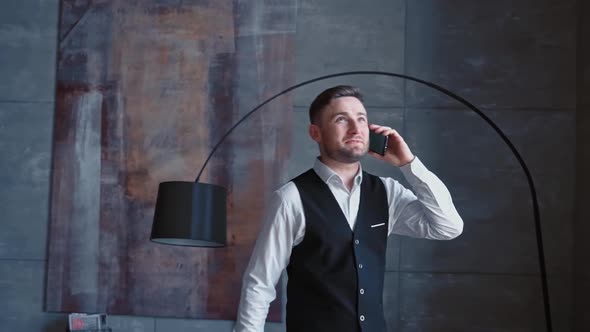 Successful Happy Businessman Luxurious Black Suit is Dialing Calling Through His Modern Smartphone