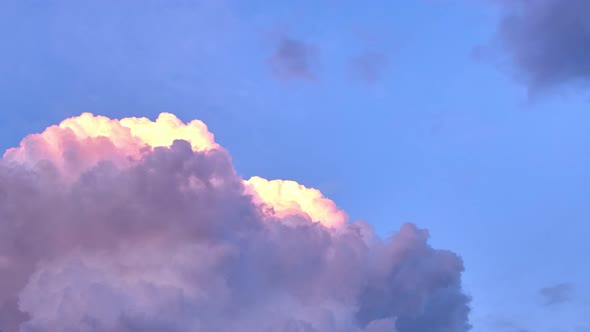 Large cumulus clouds, blue sky,  sunset  clouds colours