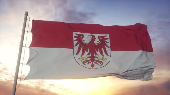 Brandenburg flag, Germany, waving in the wind, sky and sun background