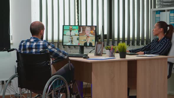 Immobilized Freelancer in Wheelchair Having Videomeeting