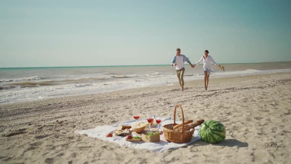 Slow Motion Happy Couple on Beach Picnic