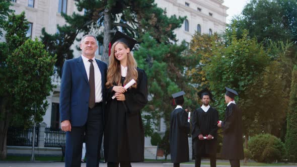 Excited Amazing Looking Graduate Lady Posing with