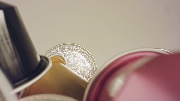 Macro shot of espresso capsules in various colors and flavors