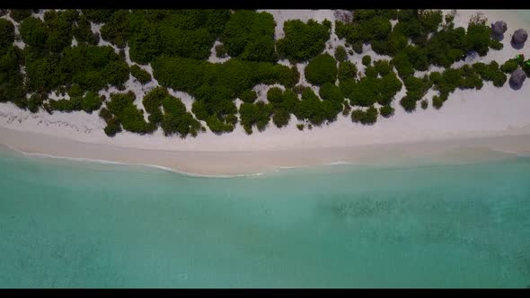 Aerial sky of relaxing shore beach trip by blue lagoon with white sandy background of a dayout near 