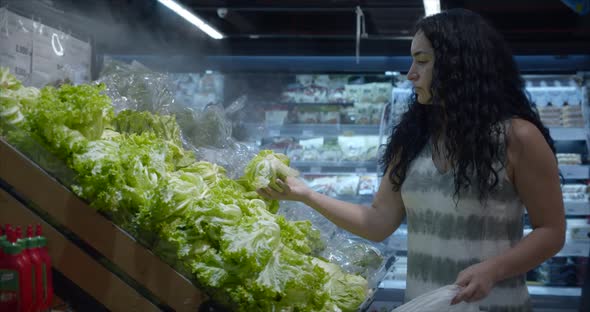 Girl Makes Purchases in the Supermarket, Healthy Food, Cabbage Salad in the Market, Supermarket