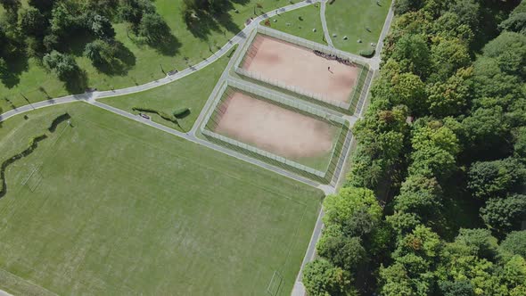 Walking paths and sports grounds in the park area. Aerial photography.