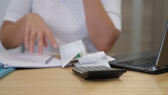 Woman Calculating Monthly Home Expenses Tax Bank Account Balance and Credit Card Bills Payment
