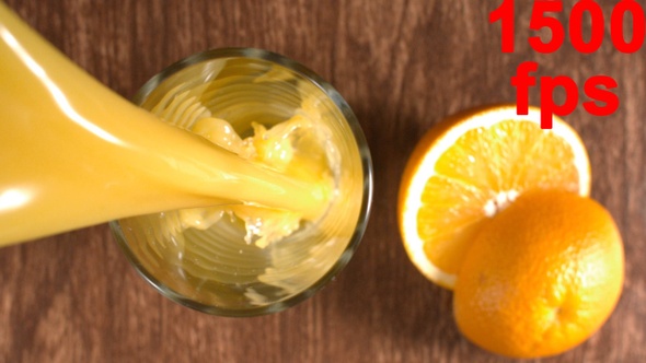 Orange Juice Pouring Into A Glass 