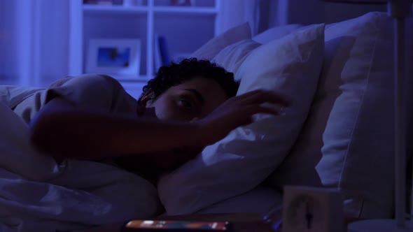 Sleeping Woman Awaking Because of Phone at Night