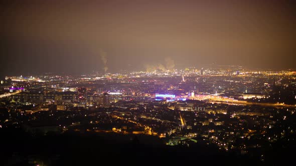 Timelapse at Night from an Mountain with view to the City Linz, Clouds and Fog