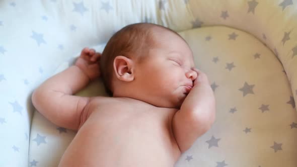 Newborn Baby Sleeping and Waking Up at Home