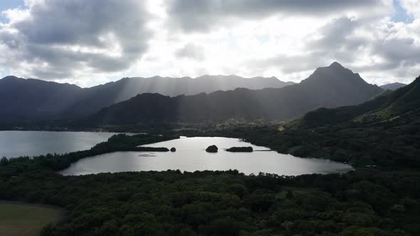 Push-in aerial shot of an ancient coastal Hawaiian fishpond in O'ahu. 4K