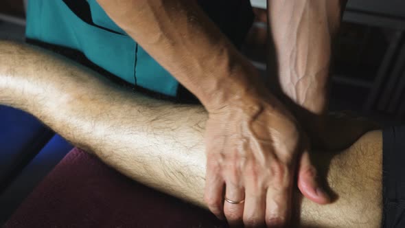 Top View Male Hands Massagist Doing Healing Rubdown Foot Young Sportsman Salon