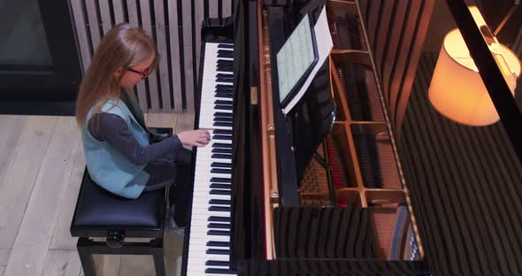 Kid Learning to Play Piano at Home