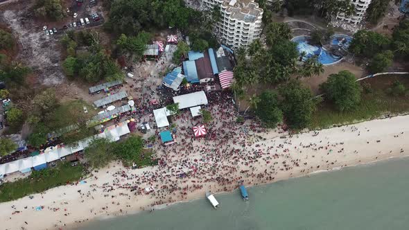 Aerial view look down crowds at floating chariot festival at Teluk Bahang