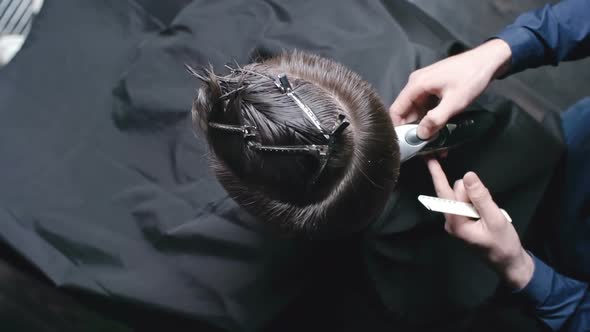 Hairdresser Shaving Neckline of Client