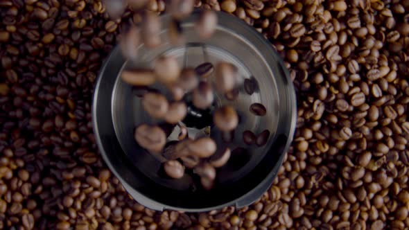 Coffee Grains Pouring Electric Grinder Close Up