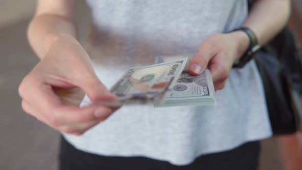 American Dollars in Women's Hands