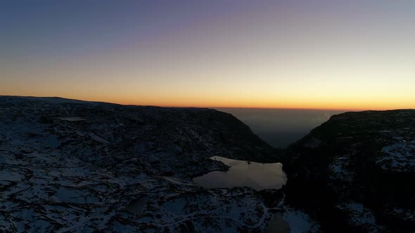 Aerial View of Snow Mountains and Lake