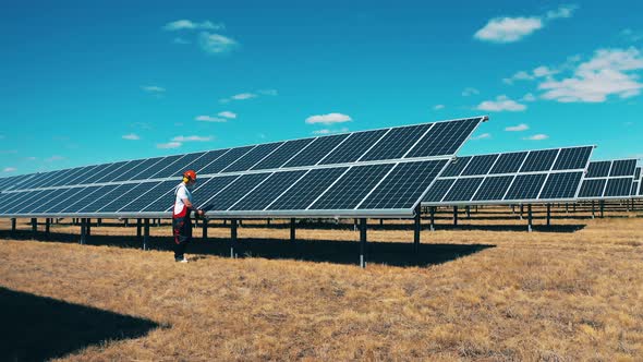 Inspector Is Checking Batteries at the Solar Power Farm