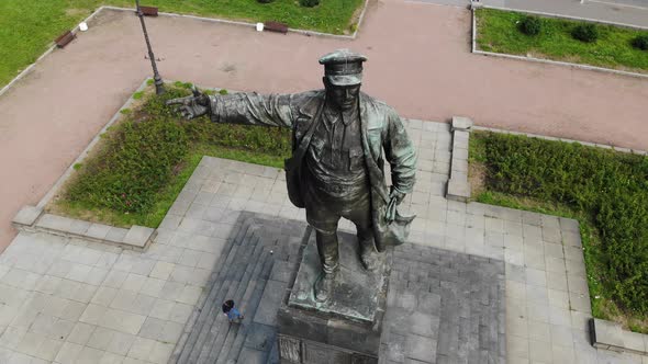 Lenin Monument on a Pedestal with Pigeons