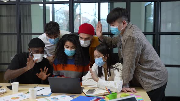 Masked Multiracial Colleagues During Video Call