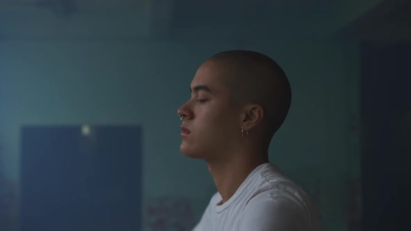 Fashionable young man in an abandoned warehouse