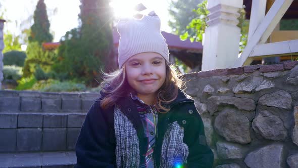 Kid Girl Face Smiling at Autumn Park