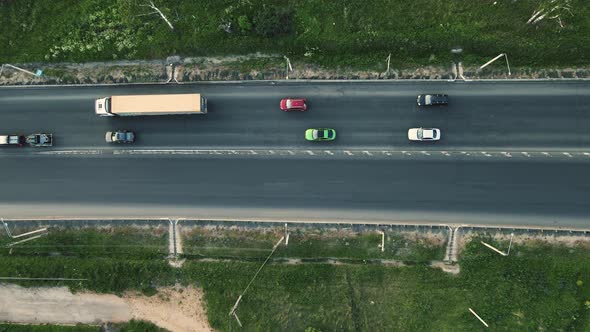 Cars Drive Along a Small Highway Bird'seye View