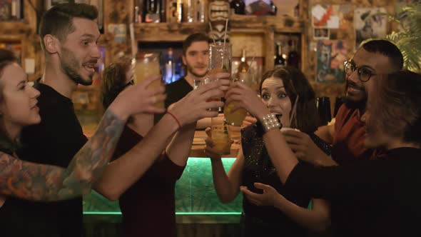 Cheerful Multiethnic Friends Partying at Bar