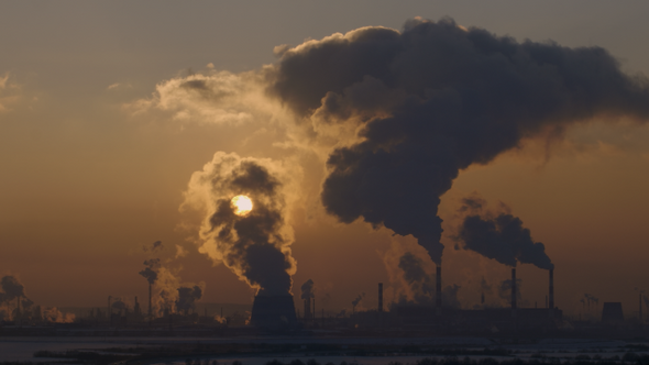 Sunset over the Smoking Thermoelectric Power Plant