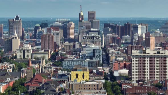 Downtown Baltimore Maryland city skyline. Aerial truck shot with long zoom.