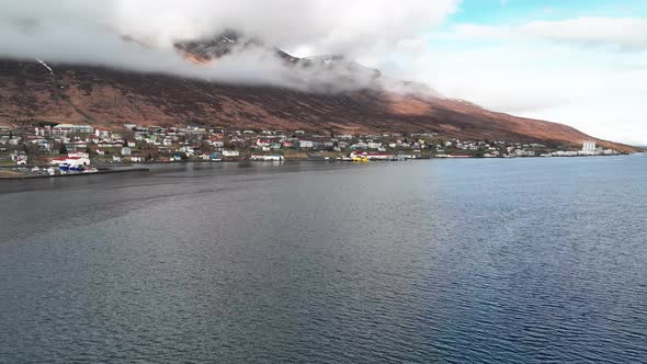 Clouds Setting In The Mountains Over Faskrudsfjordur Town In East Iceland - Hyperlapse