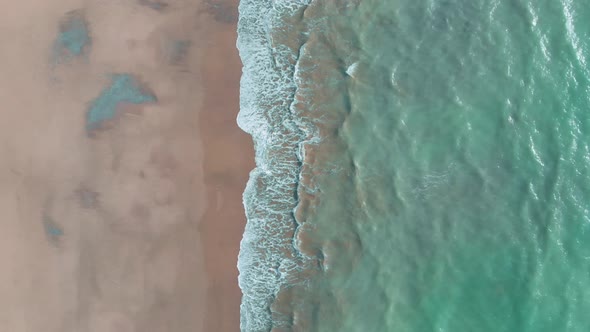 Looking Down At Beach And Waves At Balochistan. Aerial Pedestal Down, Vertical Video