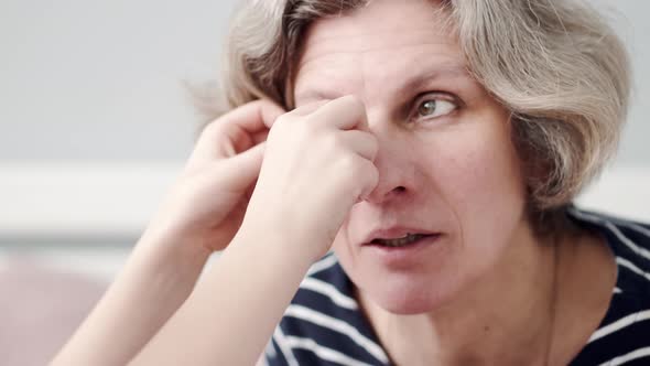 Grandmother Spending Time with Her Granddaughter in the Bedroom