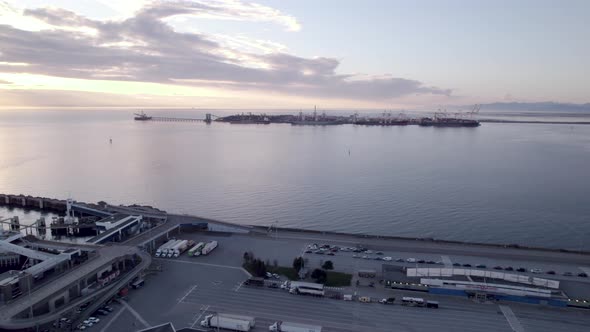 Aerial sunset seascape of Vancouver Canada Tsawwassen BC ferries terminal, silhouette at distance of