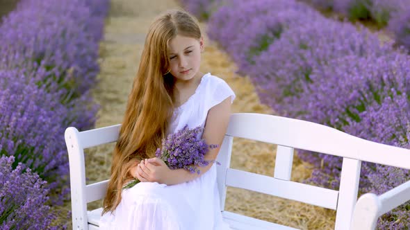 Girl Sitting on a Bench