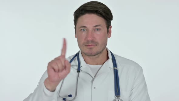 No Sign with Finger By Male Doctor White Background
