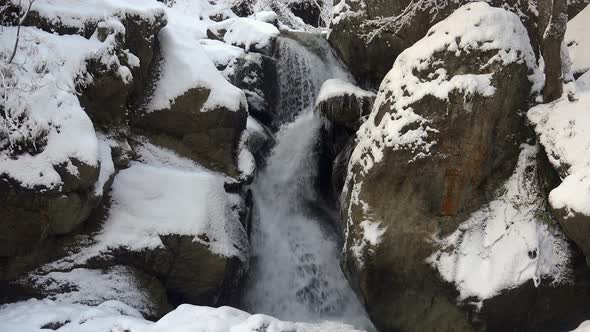 Snowy Waterfall in Winter