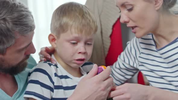 Parents Calming Crying Son alt
