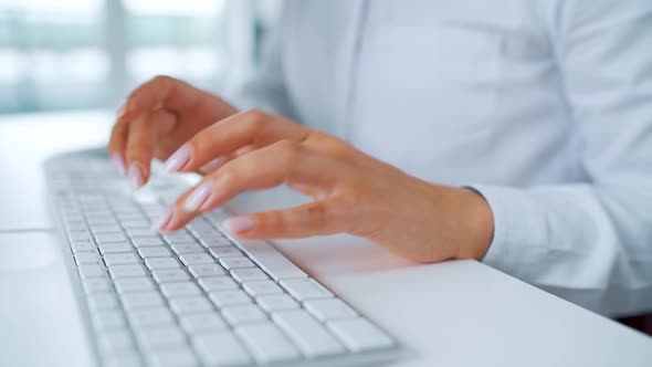 Female Hands Typing on a Computer Keyboard. Concept of Remote Work.