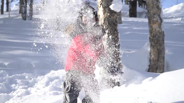 Cute Asian Child Wearing Winter Clothes Playing On Snow In The Park