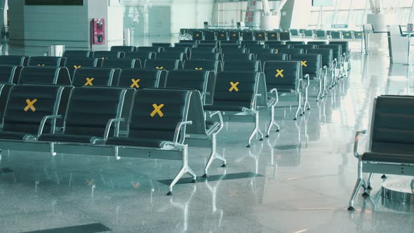 Rows of Seats at the Airport Marked with Crosses